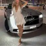 Elegant escort Alexandra in white dress