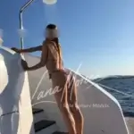 Luxury companion enjoying yacht shower