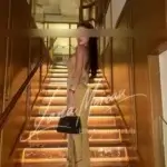 Bella on a golden staircase