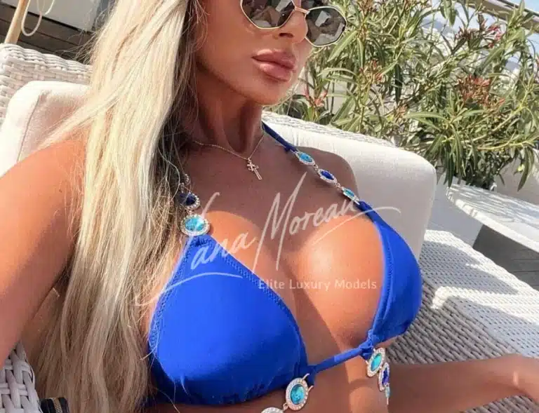 Glamorous VIP escort in blue bikini