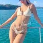 Exclusive Phuket escort Emma enjoying yacht trip in white bikini