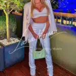 Elegant blonde High Class Escort in London in white designer outfit at night