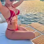 Stunning VIP Escort in red bikini on a yacht in London – elite companion experience