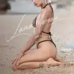 High class blonde escort with petite waist and perfect curves at Phuket seashore