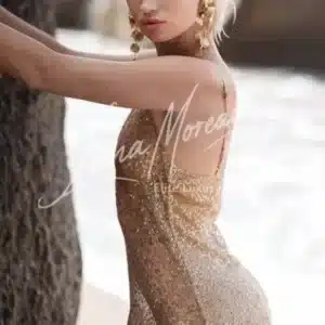 Elegant blonde high class escort model in golden glitter dress – Phuket beach view