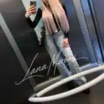 Elegant blonde model taking a mirror selfie in casual outfit in Vienna