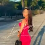 Model in vibrant pink summer dress