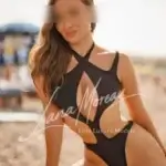 Companion in black designer swimsuit