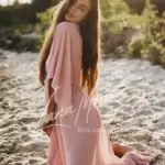 Kira, actress in soft pink gown