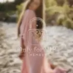 Kira, actress in soft pink gown