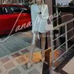 VIP escort posing outdoors at night