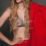 Escort Model Cannes red outfit pose
