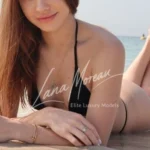 Beautiful Dubai model Stella smiling at the beach shore