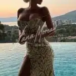 Elegant blonde model at sunset pool