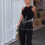 Chic city stroll – Lisa wearing a sleek black jumpsuit, perfect urban elegance