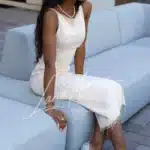 Elegant black model in white dress