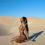 Sensual queen on sandy knees