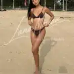 High-class model Elysia on beach