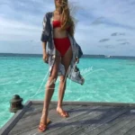 High Class Escort in bikini on tropical pier