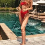 Luxury Escort Girl standing near pool