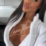 Seductive escort model in robe