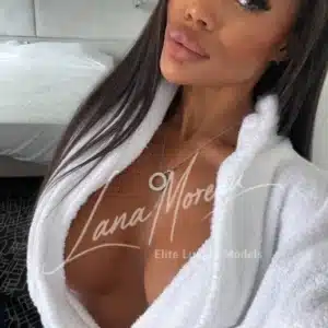 Seductive escort model in robe