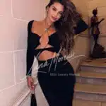 Chic escort model in black dress
