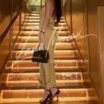 High-class model with golden dress